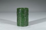 A CARVED GREEN JADE 'LANDSCAPE' BRUSHPOT