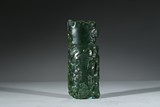 A CARVED JASPER ARMREST