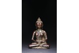 A BRONZE FIGURE OF SEATED SHAKYAMUNI