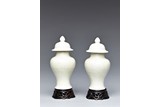 A PAIR OF WHITE GLAZED VASES AND COVER