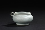 A CELADON GLAZED BIRD FEEDER BOWL