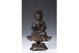 A BRONZE PARCEL GILT FIGURE OF GUANYIN