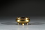 A GILT BRONZE TRIPOD CENSER