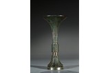 AN ARCHAIC BRONZE 'TAOTIE' RITUAL WINE VESSEL GU