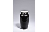A BLACK GLAZED VASE