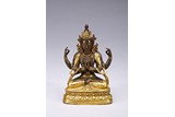 A GILT-BRONZE FIGURE OF FOUR-ARMED BODHISATTVA