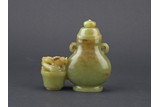A YELLOW JADE CARVED 'CHILONG' JOINED VESSEL