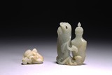 A GROUP OF TWO WHITE JADE CARVINGS 
