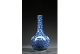 A BLUE AND WHITE 'FIGURES' BOTTLE VASE