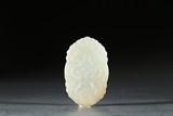 A WHITE JADE 'DRAGON AND INSCRIPTION' PENDANT