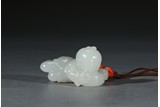 A WHITE JADE CARVING OF BOY