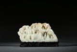 A WHITE JADE CARVED 'SIXTEEN ARHATS' HORIZONTAL MOUNTAIN BOULDER 