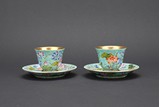 A PAIR OF FAMILLE ROSE 'LOTUS' CUPS AND HOLDERS