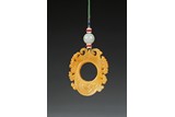 A TIANHUANG CARVED ARCHAISTIC PENDANT