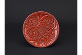 A CINNABAR LACQUER 'PEONY' DISH