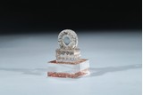 A CRYSTAL CARVED 'DHARMACHAKRA' SEAL 