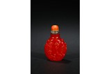 A RED GLASS 'SQUIRREL' SNUFF BOTTLE