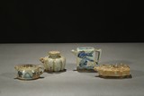 GROUP OF FOUR MINIATURE BLUE AND WHITE EWERS