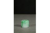 A JADEITE CARVED THUMB RING