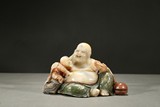 A PAINTED SOAPSTONE CARVING OF LUOHAN