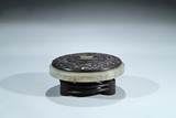 A CELADON JADE CIRCULAR INKSTONE WITH ZITAN COVER