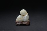 A WHITE JADE CARVED MYTHICAL BEAST