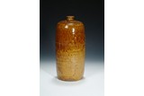A BROWN GLAZED VASE