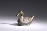 A CARVED PEWTER DUCK SHAPE BOX