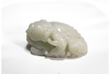 A WHITE JADE CARVING OF MYTHICAL LION AND CUB