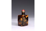 A TORTOISESHELL INSCRIBED FACETED SNUFF BOTTLE