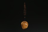 A NATURALISTIC TIANHUANG CARVED PENDANT