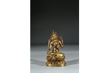 A GILT BRONZE FIGURE GREEN TARA