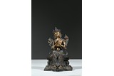 A PARCEL-GILT BRONZE FIGURE OF MAITREYA