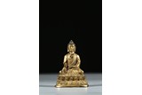A GILT BRONZE FIGURE OF SEATED BUDDHA