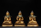 A SET OF THREE GILT BRONZE BUDDHA STATUES