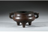 A FINE BRONZE HANDLED TRIPOD CENSER