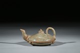 A CELADON INCISED COMPRESSED TEAPOT 