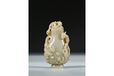 A RARE WHITE AND RUSSET JADE CARVED 'CHILONG' VESSEL