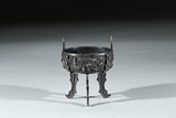 A SILVER 'LANDSCAPE' TRIPOD CENSER