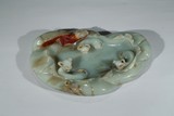A GREEN JADE BUFFALO WASHER