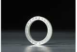 A WHITE JADE INSCRIBED RING
