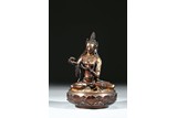 A GILT BRONZE FIGURE OF SEATED BODHISATTVA