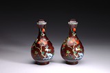 A PAIR OF ENAMELLED 'POMEGRANATE' RED GLASS VASES 