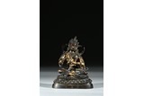 A COLD-GILDED BRONZE FIGURE OF BODHISATTVA