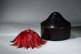 A CONICAL OFFICIAL’S HAT WITH BOX