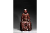 A RED LACQUER WOOD FIGURE OF TAOIST IMMORTAL ZHEN WU