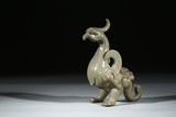 A CELADON GLAZED FIGURE OF BIRD