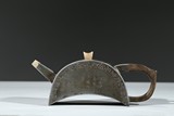 A PEWTER 'INSCRIBED' CRESCENT SHAPED TEAPOT 