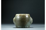 A CELADON JADE CARVED 'DRUM' PAPER WEIGHT