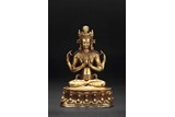 A GILT BRONZE FOUR-ARMED AVALOKITESVARA